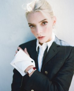 Thom Browne wool cropped jacket with quilted oxford in hunting tartan and cotton quilted oxford and cotton bow tie; Jaeger-LeCoultre Reverso One Duetto; Jean Schlumberger by Tiffany Apollo ear clips in gold with diamonds in platinum.