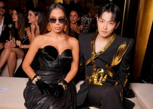 Anitta and Kim Hongjoong at the Balmain Spring 2025 ready-to-Wear show