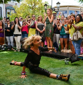 LOS ANGELES, CA - AUGUST 17:  Betsy Johnson (L) performs a cartwheel and the splits at "Extra" at The Grove on August 17, 2012 in Los Angeles, California.  (Photo by Noel Vasquez/Getty Images for Extra)