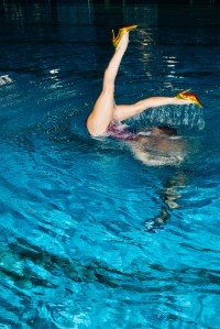 Artistic swimmers from France's national team rehearsing in Christian Louboutin pumps.