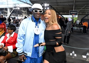 Flavor Flav and Victoria Monét at the Off-White Spring 2025 Ready-to-Wear show