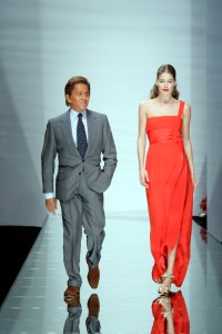 Valentino Garavani and Doutzen Kroes on the runway after Valentino's spring 2006 show at Le Carrousel du Louvre.