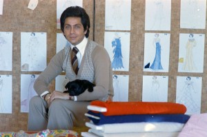 Portrait of Valentino Garavani with one of his pugs at Rome, Italy headquarters in 1974.