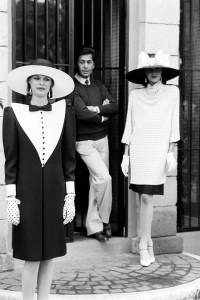 Designer Valentino Garavani poses for a portrait with a model.
