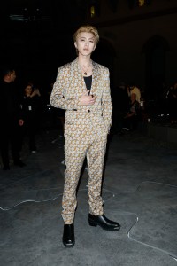 Kun at Versace at Versace Spring 2025 Ready-to-Wear Show at Milan Fashion Week