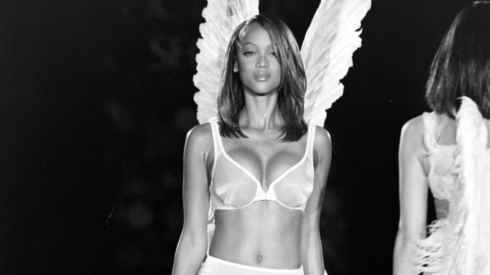 Model Tyra Banks on the runway in Victoria's Secret first Angel wings.