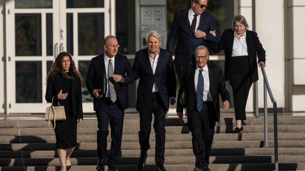 Former CEO of Abercrombie and Fitch, Mike Jeffries, (C) walks out of federal court after his arraignment on charges with the trafficking of male models for sex parties around the world, in Central Islip, New York on October 25, 2024.