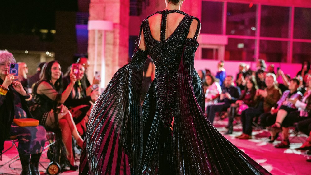 A model wearing the work of Jontay Kahm at the Fashioning Indigenous Futures Runway Show at The Getty.