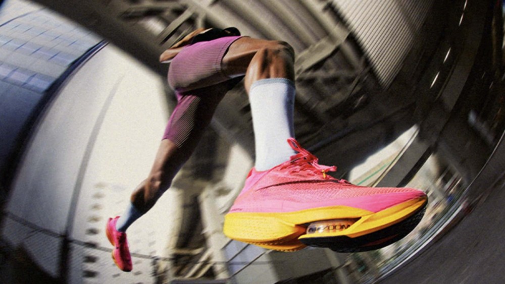 man running in cushioned running shoes