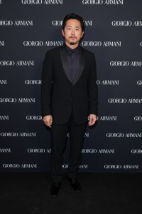 Steven Yeun at the Giorgio Armani RTW Spring 2025 fashion show held at the Park Avenue Armory on October 17, 2024 in New York, New York.