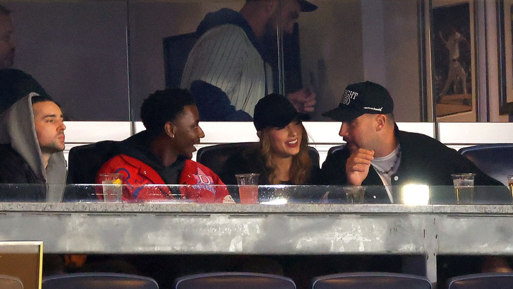 NEW YORK, NEW YORK - OCTOBER 14: Jerrod Carmichael, Taylor Swift and Travis Kelce attend Game One of the American League Championship Series between the Cleveland Guardians and the New York Yankees at Yankee Stadium on October 14, 2024 in New York City. (Photo by Mike Stobe/Getty Images)