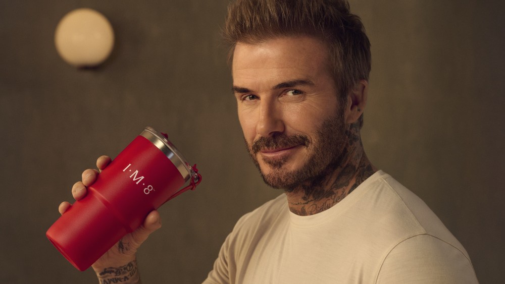 David Beckham holding IM8 branded cup