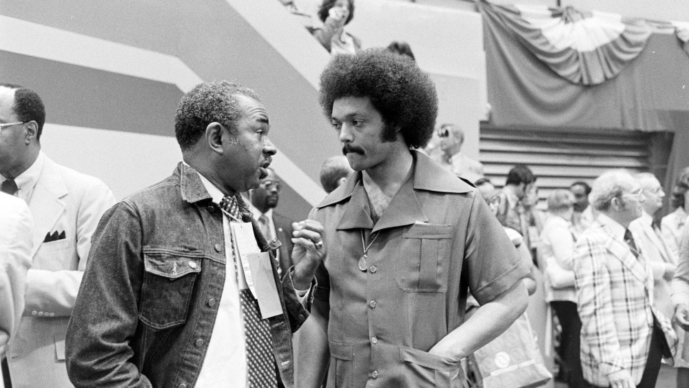 Jesse Jackson (C) attends the second day of the Democratic National Convention at Madison Square Garden in New York City on July 13, 1976.