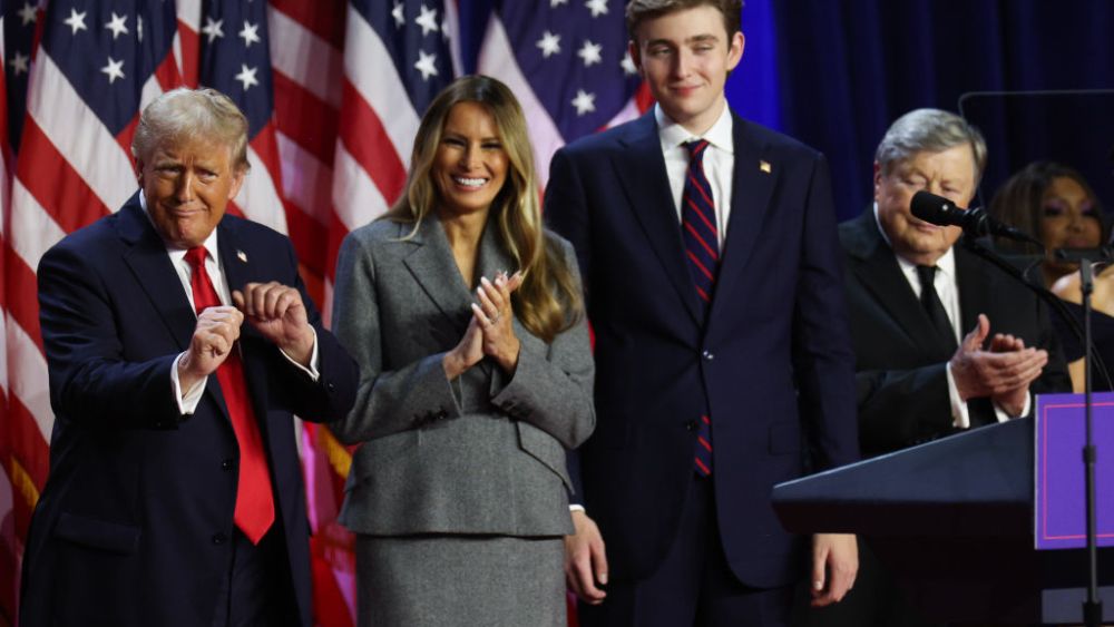 WEST PALM BEACH, FLORIDA - NOVEMBER 06:  Republican presidential nominee, former U.S. President Donald Trump dances on stage with former first lady Melania Trump and Barron Trump during an election night event at the Palm Beach Convention Center on November 06, 2024 in West Palm Beach, Florida. Americans cast their ballots today in the presidential race between Republican nominee former President Donald Trump and Vice President Kamala Harris, as well as multiple state elections that will determine the balance of power in Congress.   (Photo by John Moore/Getty Images)