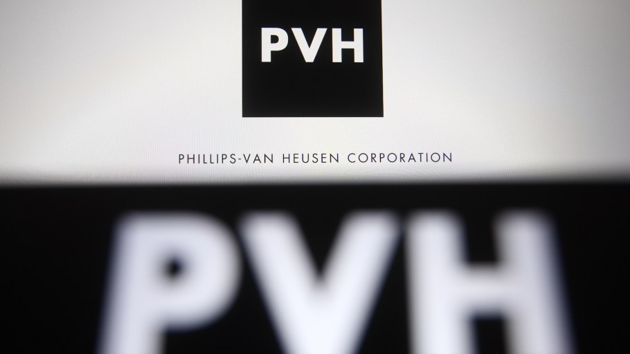 In this photo illustration the PVH Corp. logo of an US clothing company formerly known as the Phillips-Van Heusen Corporation is seen on a smartphone and a pc screen.