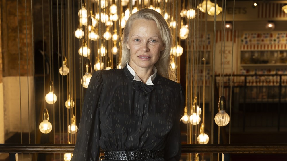 Pamela Anderson stands in a black dress with a white collar, Pamela Anderson attending a screening of The Last Showgirl at Picturehouse Central Cinema, central London. Picture date: Saturday November 23, 2024.