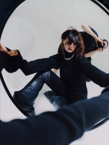 Rick Owens wool knit flightsuit. Straytukay x Rick Owens boots. Bulgari High Jewelry Serpenti necklace in rose gold with onyx elements, 4 buff-top emeralds, and pavé-set diamonds