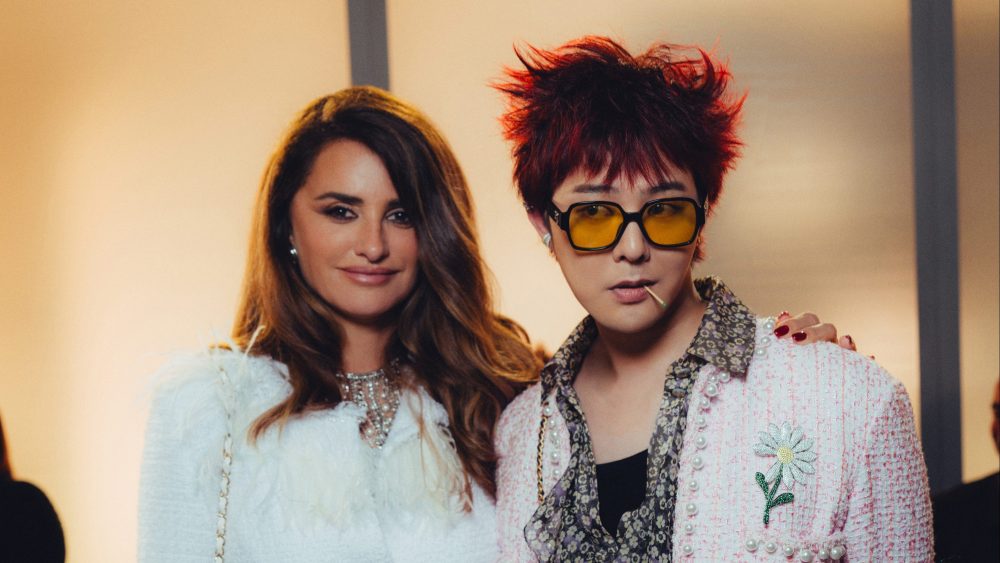 Penélope Cruz and G Dragon at Chanel's cruise 2025 replica show in Hong Kong.