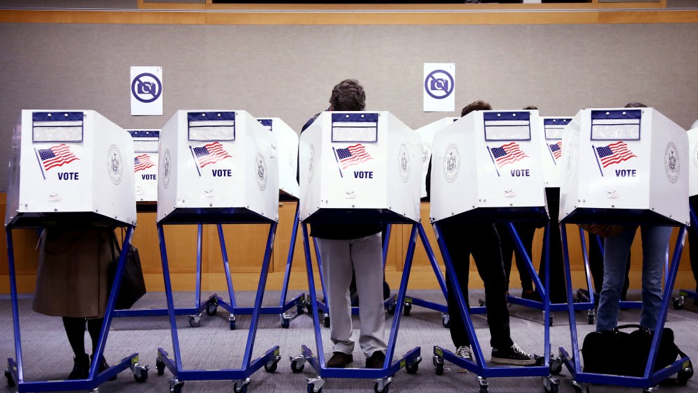 Voters fill out their ballots at a polling station in New York City on Election Day, November 5, 2024.
