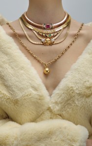 Apparis recycled polyester coat; Material Good Vintage French diamond and ruby necklace; Bulgari Tubogas 18-karat rose gold necklace set with a central rubellite, chrysoprase inserts and pavé diamonds; Suzanne Kalan Golden Midi Stacker Diamond Tennis Necklace in 18-karat gold and white diamond baguettes; Halleh 18-karat yellow gold, enamel and emerald necklace;

Tiffany & Co. Tiffany HardWear Small Wrap Necklace in yellow gold photographed in New York, New York on November 19th, 2024.