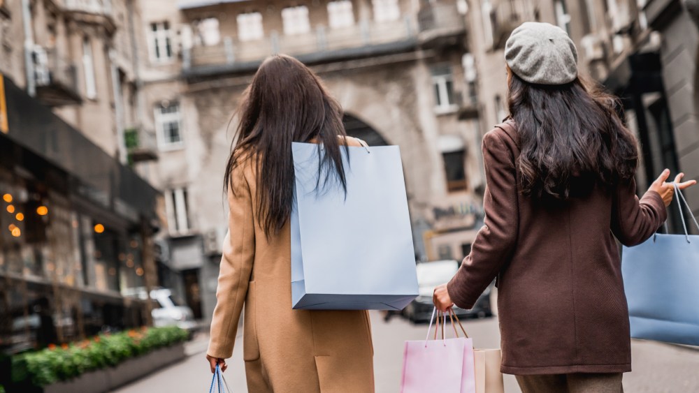 Consumers shopping in a city.