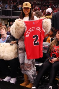 CHICAGO, ILLINOIS - DECEMBER 21: Rapper Megan Thee Stallion looks on during the second half between the Chicago Bulls and the Boston Celtics at the United Center on December 21, 2024 in Chicago, Illinois. NOTE TO USER: User expressly acknowledges and agrees that, by downloading and or using this photograph, User is consenting to the terms and conditions of the Getty Images License Agreement.  (Photo by Michael Reaves/Getty Images)