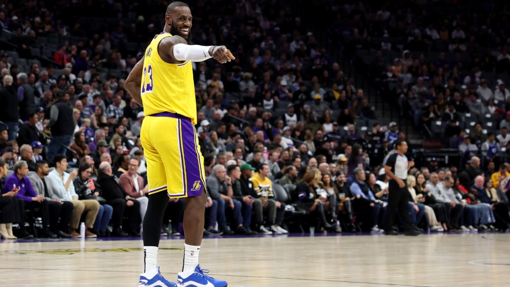 eBron James #23 of the Los Angeles Lakers points back to the Sacramento Kings' bench in the first half at Golden 1 Center on December 19, 2024 in Sacramento, California.