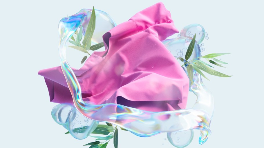 A pink fabric adorned with green leaves and translucent bubbles, creating a vibrant and playful visual effect.