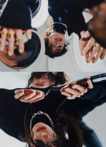 Rick Owens wool knit flight suit; Bulgari High Jewelry Serpenti necklace in rose gold with onyx elements, buff-top emeralds and pavé-set diamonds, Bulgari B.zero1 XXth Anniversary five-band ring in 18-karat yellow gold; Bulgari Serpenti Viper one-coil 18-karat yellow gold ring.