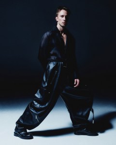 Drew Starkey, star of new A24 movie 'Queer. Saint Laurent by Anthony Vaccarello silk crepe shirt; Loewe nappa calfskin balloon cargo trousers. Valentino shoes.