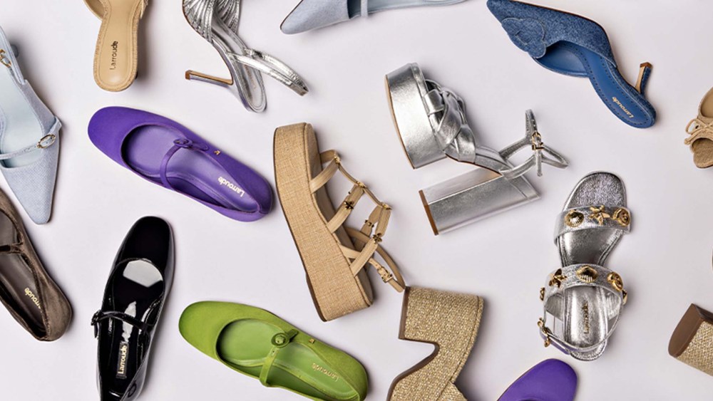assorted summer shoes on gray background