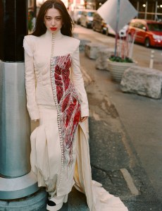 Thom Browne couture anatomical dress with hand-embroidered beads and Swarovski crystals; Chanel metal and glass earring and shoes; Boucheron Wladimir the Cat stud earrings with pink and black lacquer, round diamonds, tsavorites, eyes made from green agates, tsavorites and black sapphires and Wladimir the Cat ring pear tsavorite totaling, round tsavorites, fantasy-cut tsavorites, round diamonds, black sapphires, quartz mother-of-pearl and 18-karat white gold.
