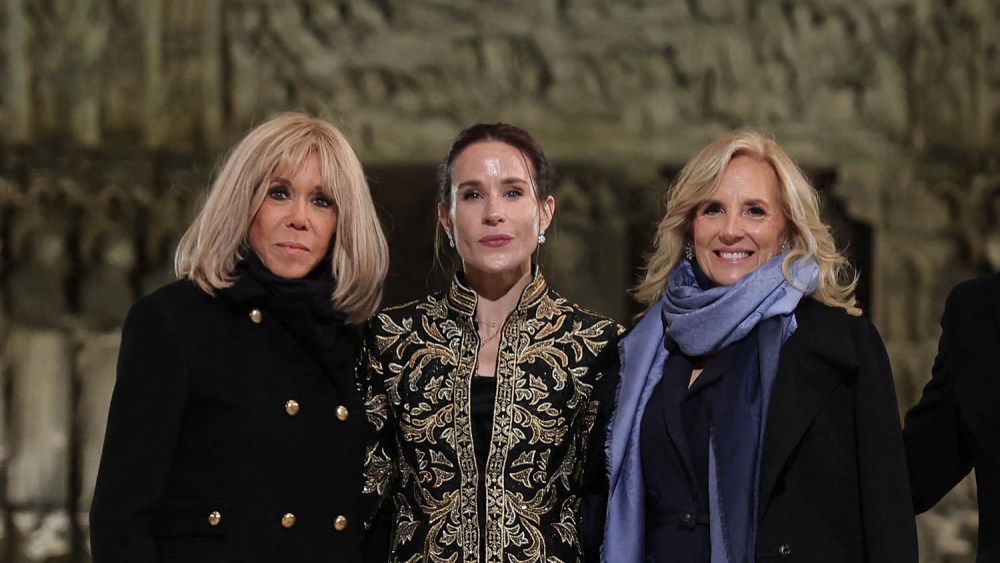 alice and olivia thomas coat, French President Emmanuel Macron (R) and his wife Brigitte Macron (L) pose with First Lady of the United States Jill Biden (CR) and her daughter Ashley Biden (CL) outside Notre-Dame Cathedral ahead of a ceremony to mark the re-opening of the landmark cathedral, in central, Paris on December 7, 2024. Around 50 heads of state and government are expected in the French capital to attend the ceremony marking the rebuilding of the Gothic masterpiece five years after the 2019 fire which ravaged the world heritage landmark and toppled its spire. Some 250 companies and hundreds of experts were part of the five-year restoration project at a cost of hundreds of millions of euros. (Photo by Christophe PETIT TESSON / POOL / AFP) (Photo by CHRISTOPHE PETIT TESSON/POOL/AFP via Getty Images)