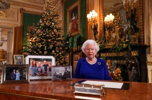 A picture released on December 24, 2019 shows Britain's Queen Elizabeth II posing for a photograph after she recorded her annual Christmas Day message, in Windsor Castle, west of London. During her traditional Christmas address, Queen Elizabeth II intends to call on the British to overcome their divisions after a year "full of pitfalls", between Brexit tearing apart her country and scandals shaking the British royal family, according to extracts from the address broadcast in advance.