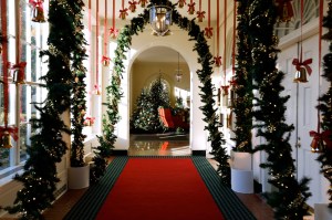 Brass-colored bells hang from the ceiling and sleigh bells line the archways of the East Colonnade during a media preview of the 2024 holiday decorations at the White House on December 02, 2024 in Washington, DC.