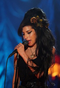 LONDON - FEBRUARY 10:  British singer Amy Winehouse performs at the Riverside Studios for the 50th Grammy Awards ceremony via video link on February 10, 2008 in London, England.  Winehouse won 5 out of her 6 nominations including, record of the year, best new artist, song of the year, pop vocal album and female pop vocal performance.  (Photo by Peter Macdiarmid/Getty Images for NARAS)