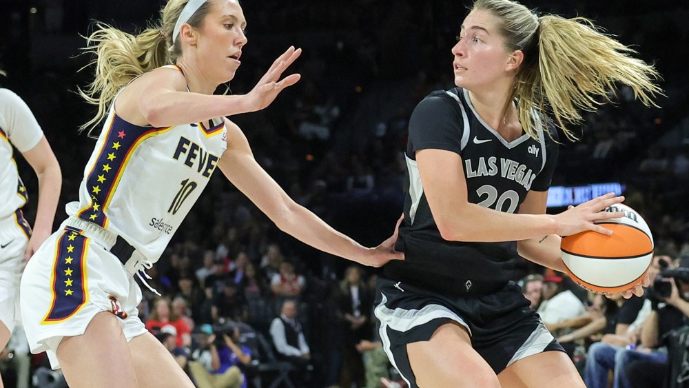 Kate Martin (right) of the Las Vegas Aces looks to pass against Lexie Hull of the Indiana Fever.