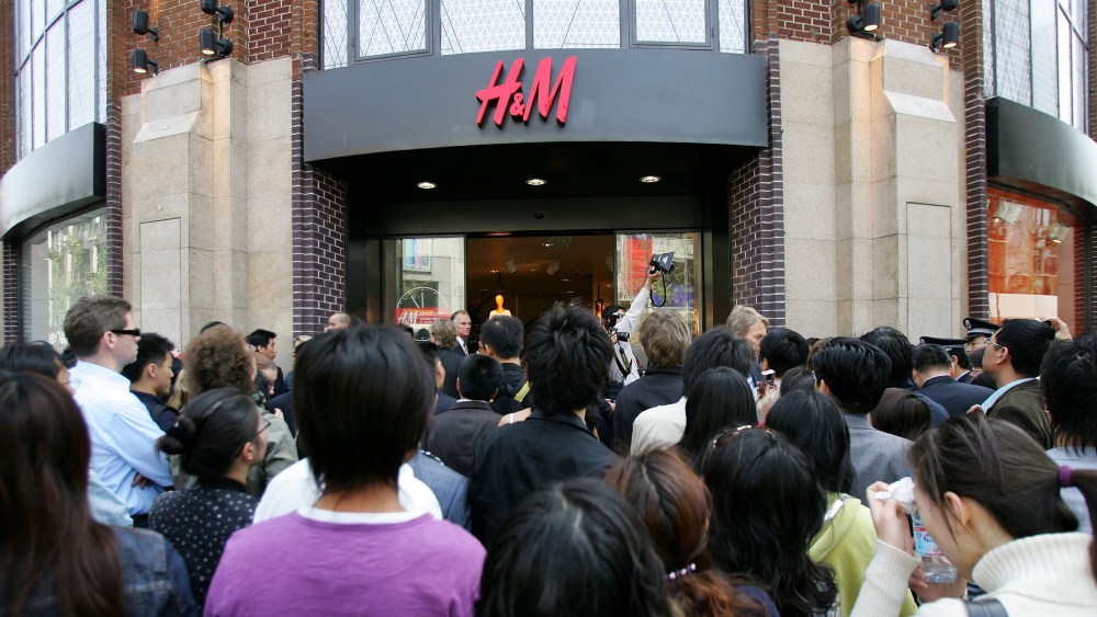 Chinese shoppers wait in line to enter the H&M store, the first in mainland China in 2007 in Shanghai.