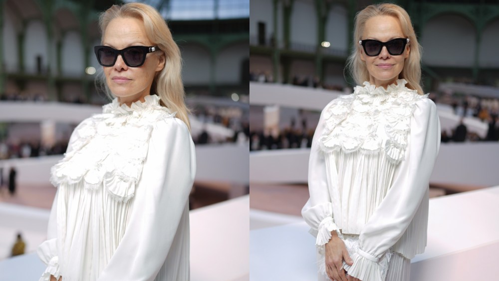 Pamela Anderson at Chanel's spring 2025 couture fashion show on Jan. 28 in Paris, pleated pants, ruffled blouse