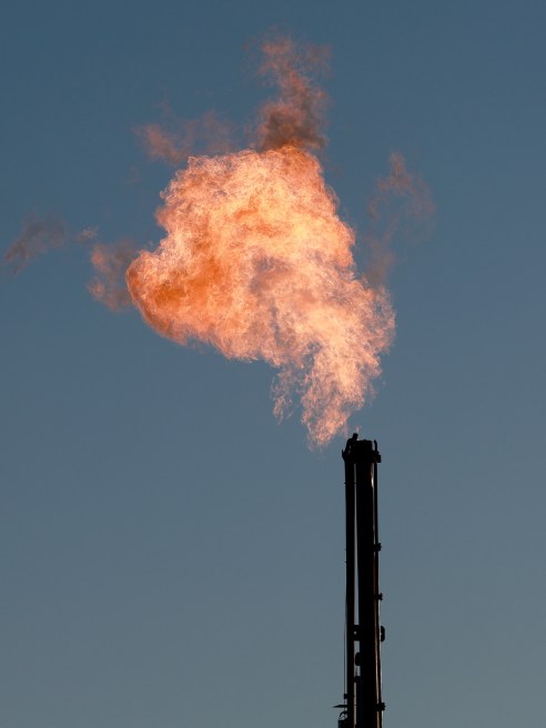Natural gas is flared off during an oil drilling operation in the Permian Basin oil field on March 12, 2022 in Midland, Texas.
