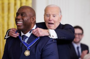 WASHINGTON, DC - JANUARY 4: U.S. President Joe Biden reacts while awarding Former NBA player Earvin "Magic" Johnson the Presidential Medal of Freedom in the East Room of the White House on January 4, 2025 in Washington, DC. President Biden is awarding 19 recipients with the nation's highest civilian honor. (Photo by Tom Brenner/Getty Images)