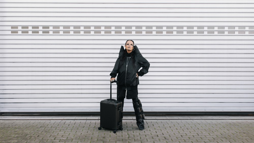 Michèle Lamy with the Rimowa x Rick Owens Original Cabin Bronze suitcase.