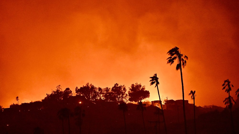 Homes burn above Pacific Coast Highway near Will Rodgers State Beach during the Palisades Fire on Wednesday, January 8, 2025, in Pacific Palisades, CA.