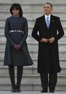 US President Barack Obama and First Lady Michelle Obama review troops before departing from the US Capitol after the 57th Presidential Inauguration ceremonial swearing-in on January 21, 2013 in Washington, DC.