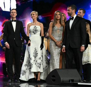 US President Donald Trump (2nd L) stands with First Lady Melania Trump, US Vice President J.D. Vance, Second Lady Usha Vance, Jared Kushner, daughter Ivanka Trump, granddaughter Kai Madison Trump, sons Donald Trump Jr. and Eric Trump, and daughter Tiffany during the Liberty inaugural ball in Washington, DC, on January 20, 2025. (Photo by Jim WATSON / AFP) (Photo by JIM WATSON/AFP via Getty Images)