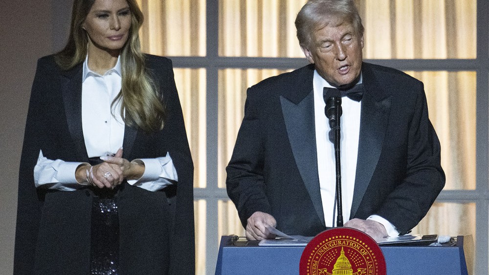 TOPSHOT - Melania Trump dole and gabbana watches her husband, US President-elect Donald Trump, speak at a candlelight dinner at the National Building Museum in Washington, DC, on January 19, 2025, a day before his inauguration ceremony. (Photo by Jim WATSON / AFP) (Photo by JIM WATSON/AFP via Getty Images)
