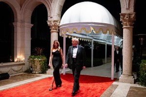 PALM BEACH, FLORIDA - DECEMBER 31:  U.S. President-elect Donald Trump and his wife Melania Trump arrive on New Year's Eve at his Mar-A-Lago Club on December 31, 2024 in Palm Beach, Florida. Trump continues to fill posts in his upcoming administration ahead of his January 20 inauguration. (Photo by Eva Marie Uzcategui/Getty Images)