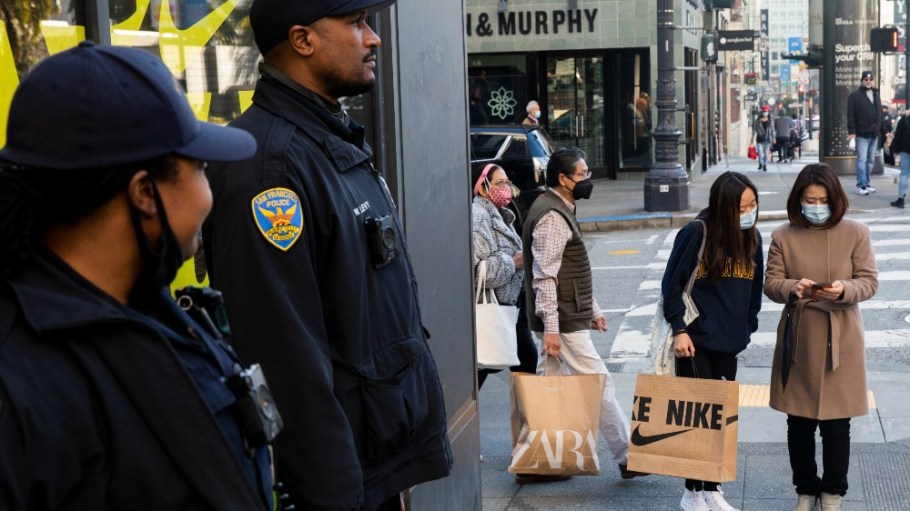 San Francisco Police officers stand guard outside of the Nike store.
