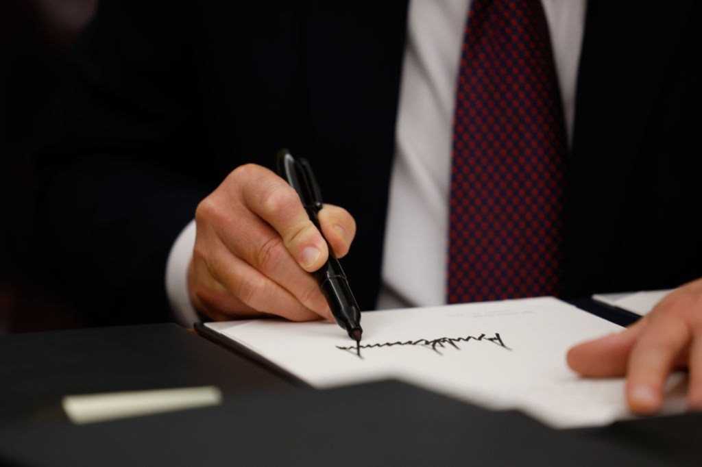 Donald Trump signing an executive order