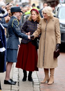 CANTERBURY, ENGLAND - FEBRUARY 25: Queen Camilla shakes hands with a member o the military as she arrives for a visit to The Beaney House of Art & Knowledge on February 25, 2025 in Canterbury, England. The Queen visits Canterbury to unveil a life-size bronze statue of Aphra Behn, who was considered the first professional female writer in the English language and one of the most popular playwrights of the 17th century. (Photo by Chris Jackson/Getty Images)